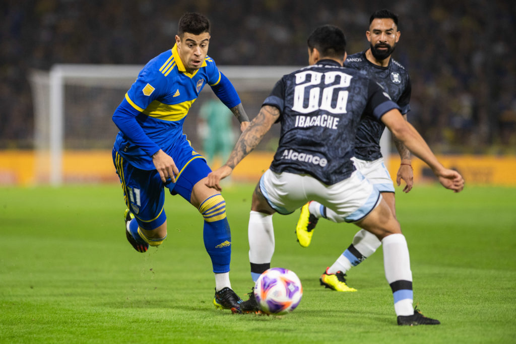Martin Payero (L) of Boca Juniors seen in action during a